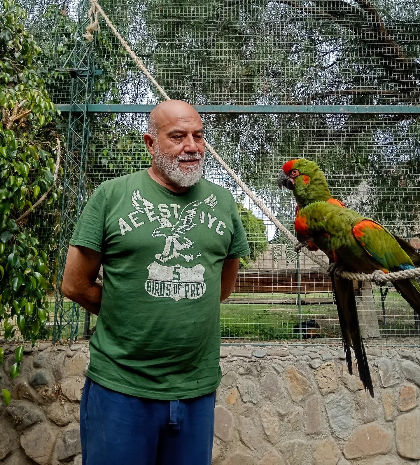 Marcelo Antezana with red-fronted macaws